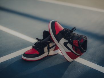 pair of black-white-and-red Air Jordan 1 shoes